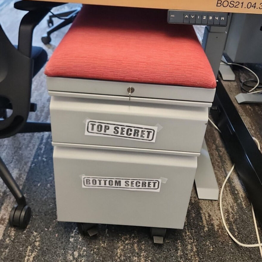 Filing cabinet with humorous top secret and bottom secret labels, illustrating a joke so horrible it gained angry upvotes.