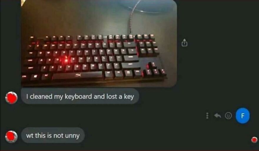Mechanical keyboard missing a key after cleaning with text messages reacting to a horrible joke and angry upvotes.