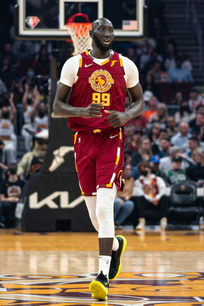 Tacko Fall wearing Cleveland Cavaliers uniform on the basketball court during an NBA game.