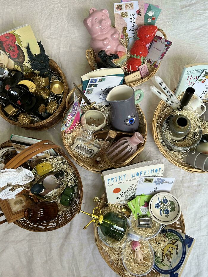 Baskets filled with various secondhand store finds including ceramics, books, and vintage trinkets offering unexpected surprises.