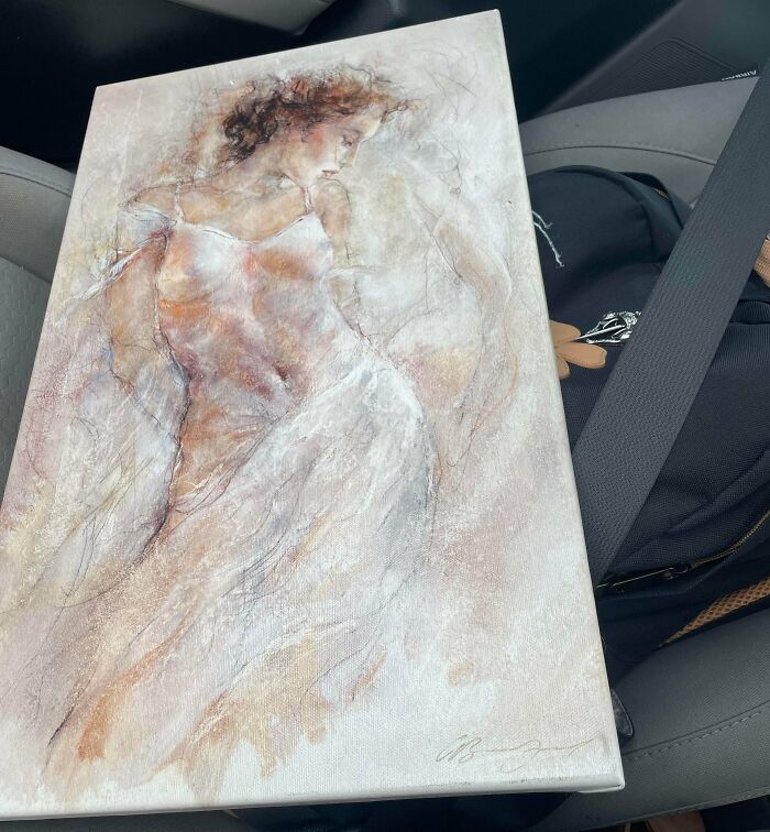 Delicate artwork of a woman in a flowing dress found as a cool, unexpected secondhand store surprise.