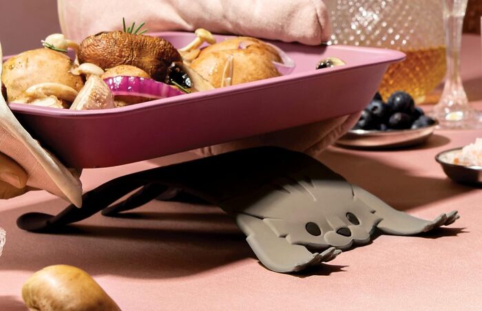 A Cat Trivet Will Protect Her Countertops From Hot Pans With The Kind Of Adorable, Slightly Judgmental, And Deeply Unimpressed Stare That Only A Cat Can Truly Master