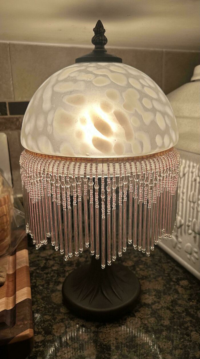 Vintage beaded lamp found in secondhand stores delivering cool, unexpected surprises on a kitchen countertop.