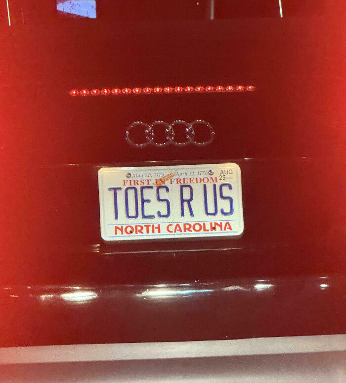 Personalized license plate reading TOES R US on a North Carolina car, showcasing hilarious custom plates that catch attention.