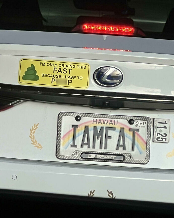 Personalized license plate reading I AM FAT on a white Lexus with a humorous bumper sticker in Hawaii.