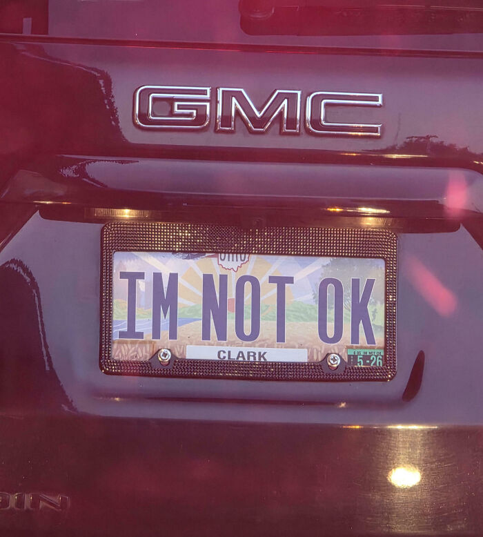 Personalized license plate on a GMC vehicle reading IM NOT OK, showcasing hilarious personalized license plates.