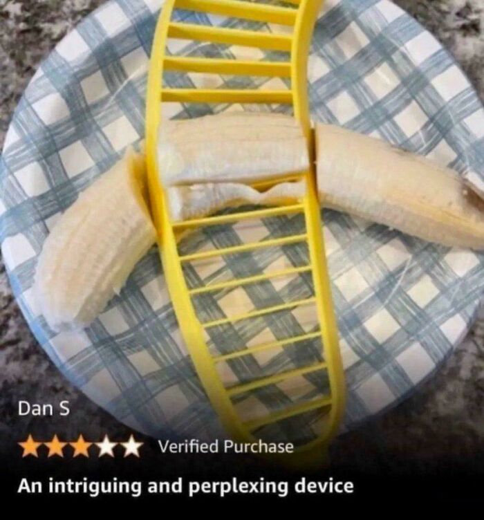 Yellow plastic banana slicer on a peeled banana on a plate, humorous and perplexing post that makes you laugh.