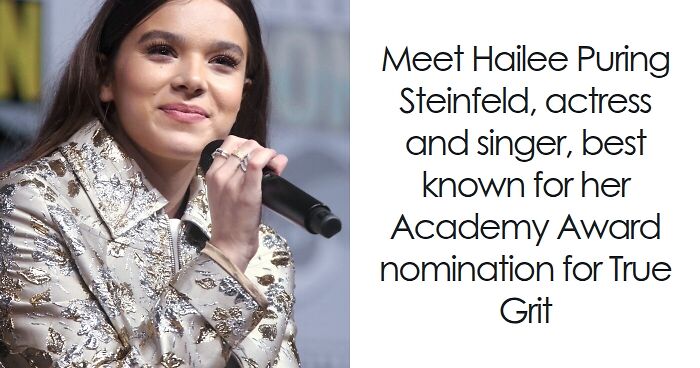Hailee Steinfeld speaking into a microphone, wearing a patterned silver jacket at a public event or panel discussion.