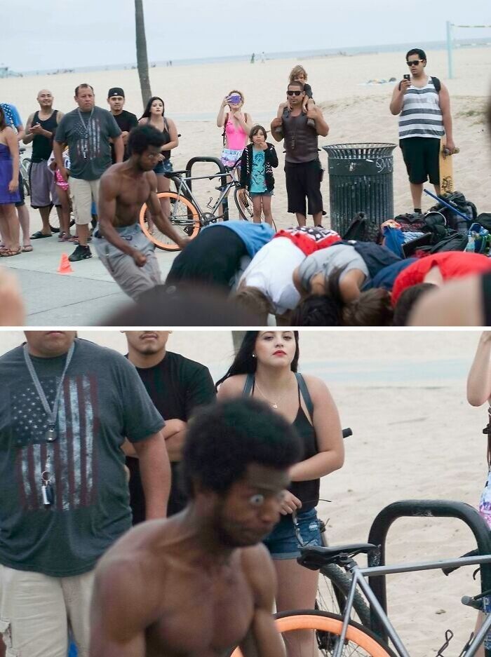Crowd watches a shirtless man with wide eyes at the beach in a funny and interesting weird pic taken at the perfect time.