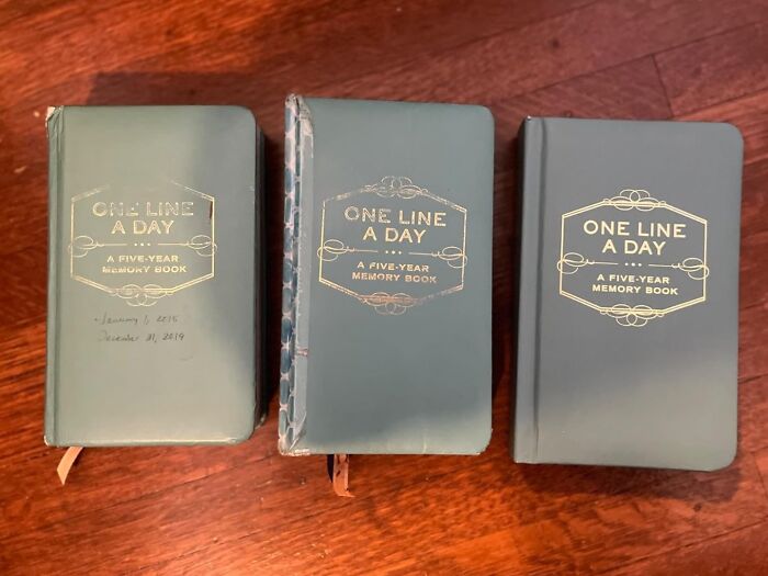 Three One Line A Day five-year memory books on a wooden surface, unique gift idea to make presents stand out.