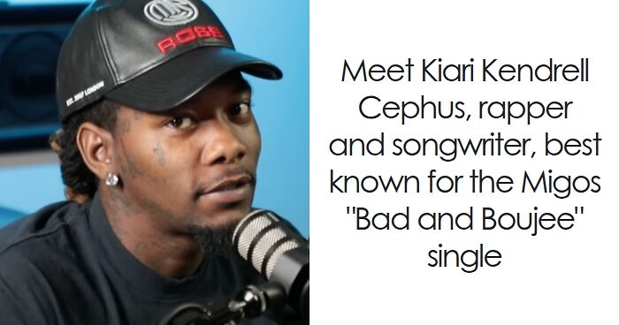 Offset speaking into a microphone during an interview, wearing a black cap and shirt, sharing career highlights.