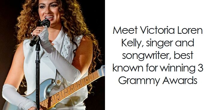 Tori Kelly performing live on stage, holding a guitar and singing into a microphone during a concert event