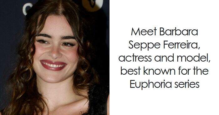 Barbie Ferreira smiling at an event, with wavy hair and natural makeup, known for her acting and modeling career.