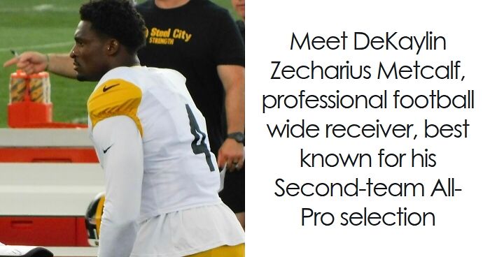 DK Metcalf in football gear sitting on the bench during a game, highlighting his career as a wide receiver.