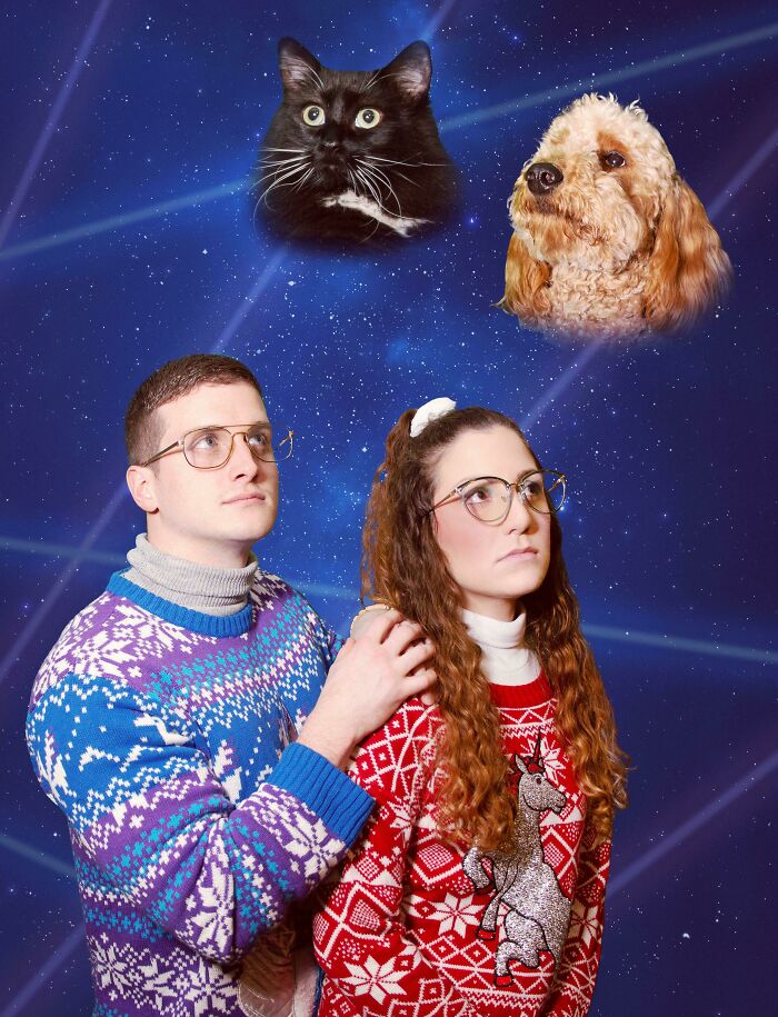 Couple in awkward holiday sweaters posing with floating pet portraits in a hilariously awkward family Christmas photo.
