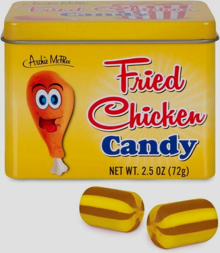 Yellow tin of fried chicken candy with cartoon chicken leg and two striped hard candies below, quirky snack gift idea.