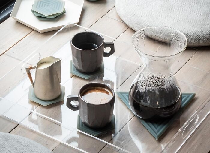 Coffee set with mugs, a creamer, and a glass carafe on a tray, ideal last-minute gifts for unexpected guests.