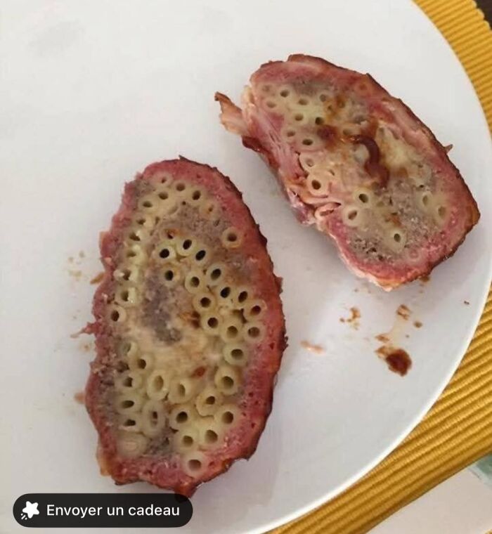 Mac and cheese pork loaf slices served on a white plate, an unusual food pic that deserves to be shamed online.