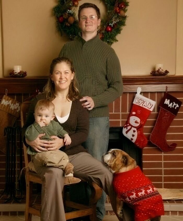 Family posing for a Christmas photo with a dog in a red sweater, showcasing awkward family Christmas photo moments.