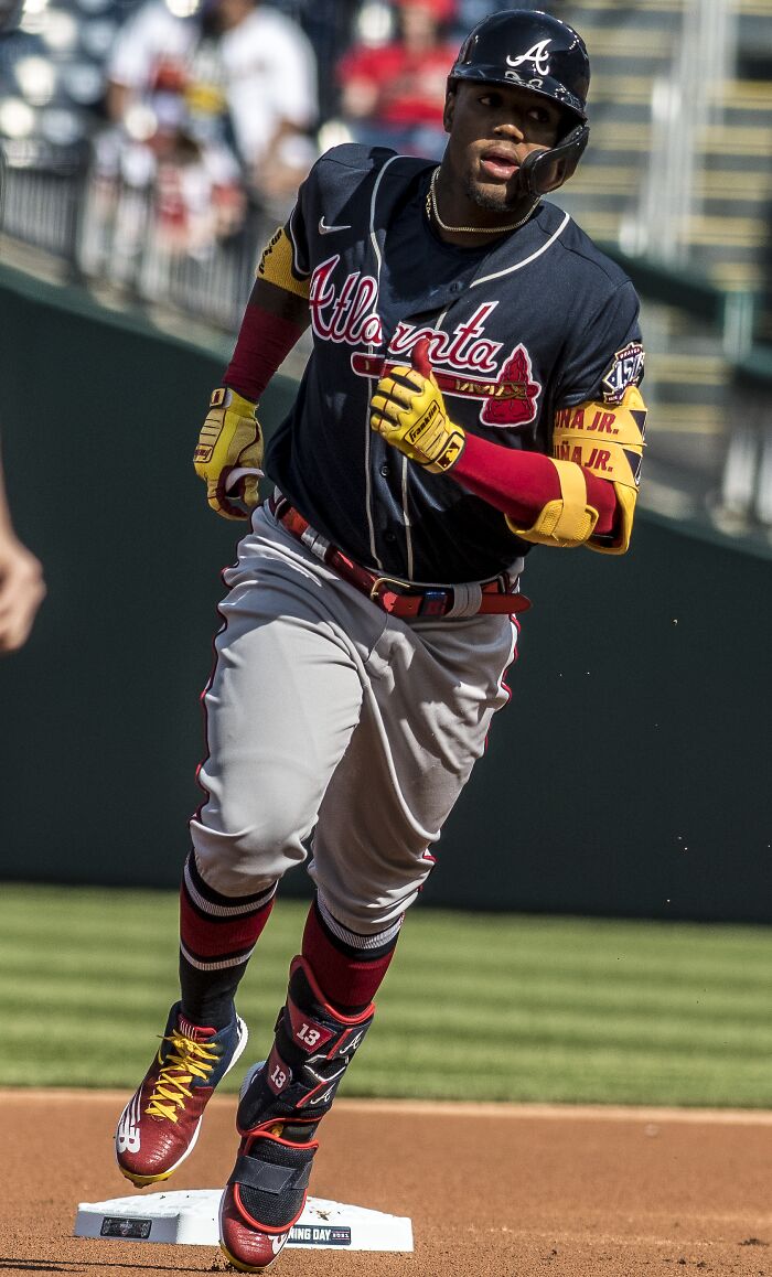 Ronald Acu&ntilde;a Jr. in Atlanta Braves uniform running the bases during a professional baseball game.
