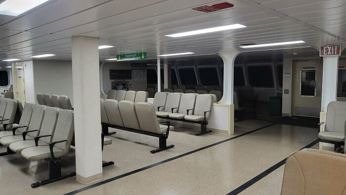 Empty waiting area seating in a liminal space resembling the eerie and creepy atmosphere of the Backrooms.