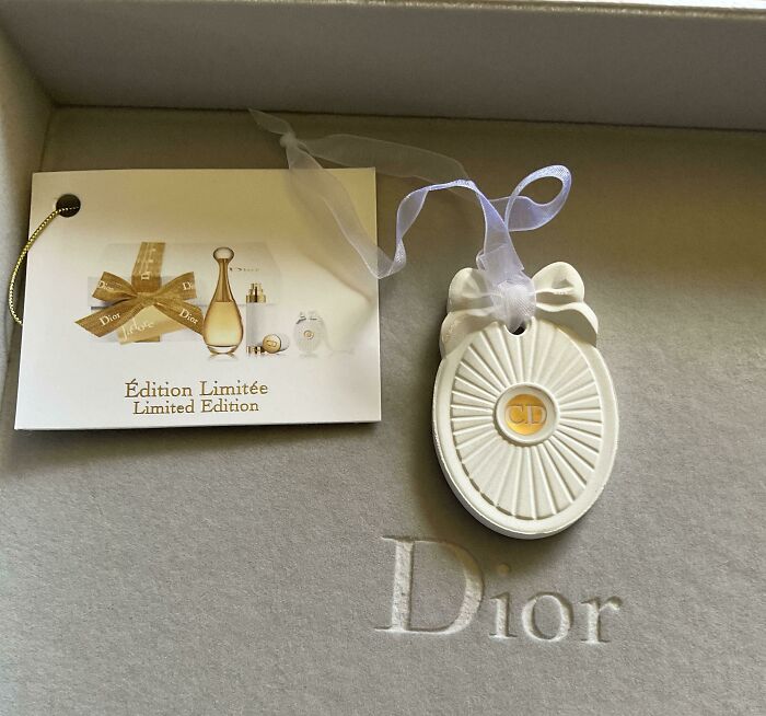 Limited edition Dior ornament with a bow and ribbon, an example of bizarre Christmas gifts people received.