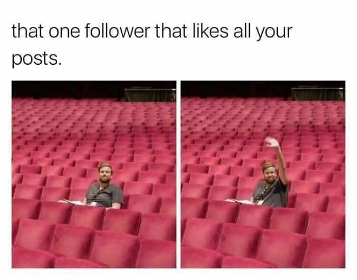 Man sitting alone in a large empty theater, raising hand, illustrating funny memes to help you disassociate concept.