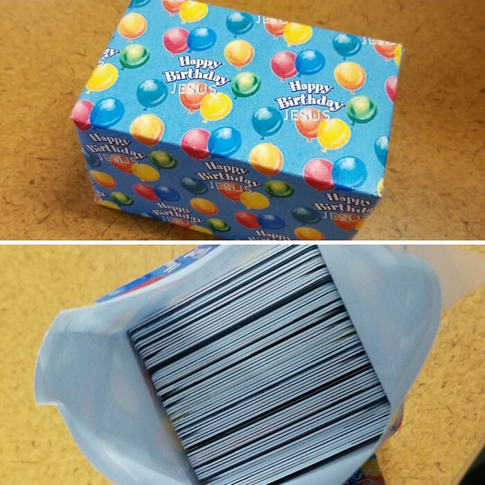 Unusually wrapped Christmas gift box with Happy Birthday Jesus paper containing a large stack of cards inside.