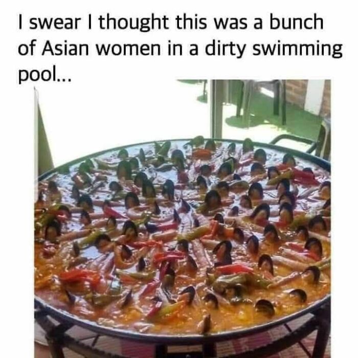 A large pan of food with chili peppers and black beans, creating a funny visual meme to help disassociate.