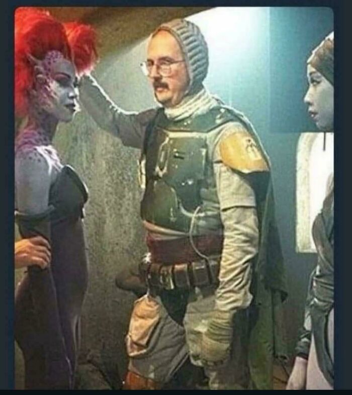 Man in detailed sci-fi costume interacting with two people in alien makeup, showcasing interesting cosplay moments for internet viewers