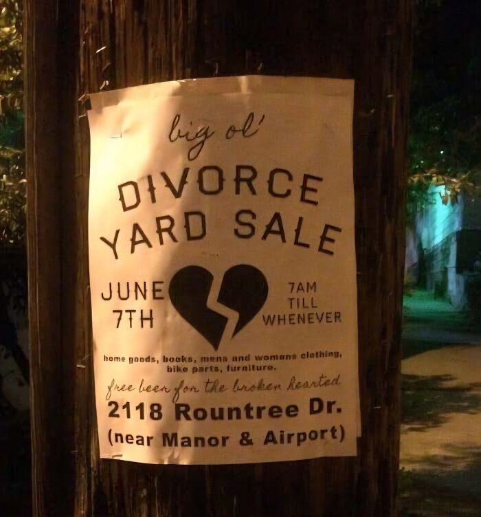 Funny stupid sign for a divorce yard sale with a broken heart symbol and offers free beer for the broken hearted.