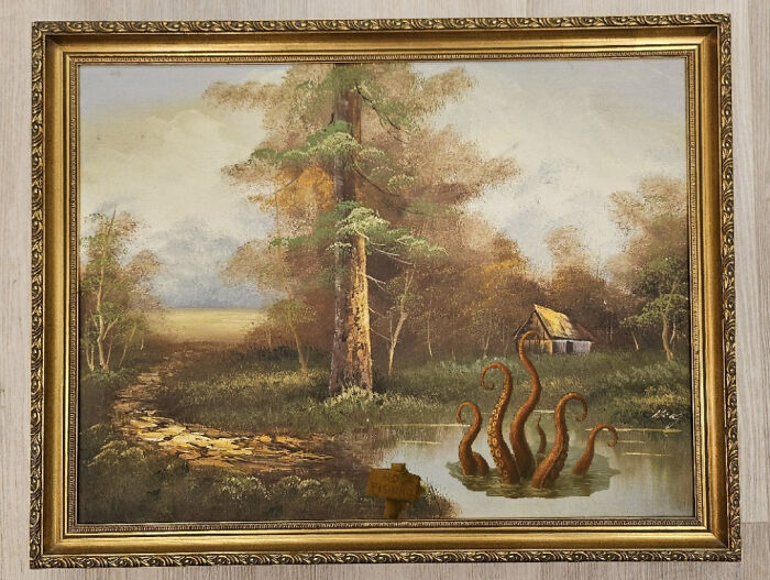 Vintage landscape painting of a forest and pond humorously altered with giant octopus tentacles rising from the water.