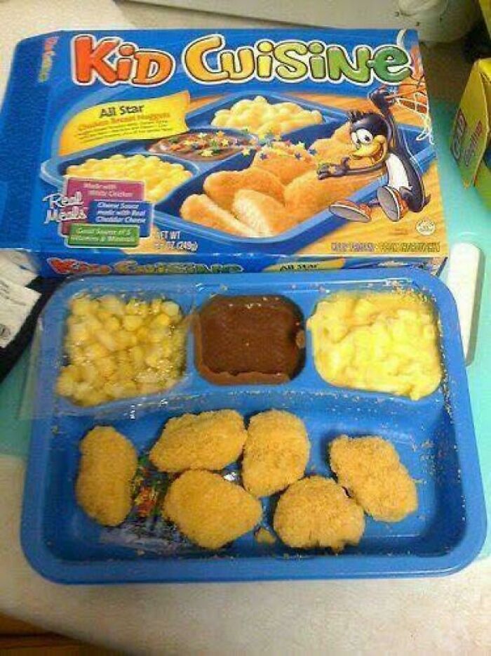 90s and 2000s nostalgia with a classic Kid Cuisine frozen meal featuring chicken nuggets and sides in a blue tray.