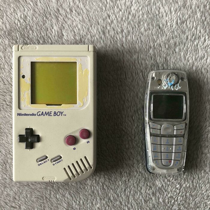 Worn Nintendo Game Boy and vintage Nokia phone side by side, evoking 90s and 2000s nostalgia memories.