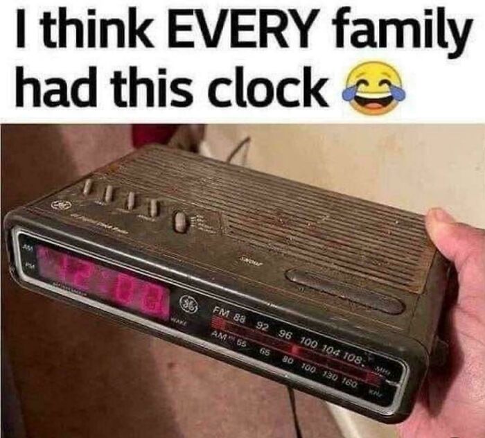 Vintage digital clock radio held in hand with 90s and 2000s nostalgia reminding viewers of childhood memories.