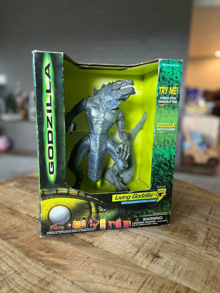 Godzilla action figure in original packaging, evoking 90s and 2000s nostalgia and childhood memories.