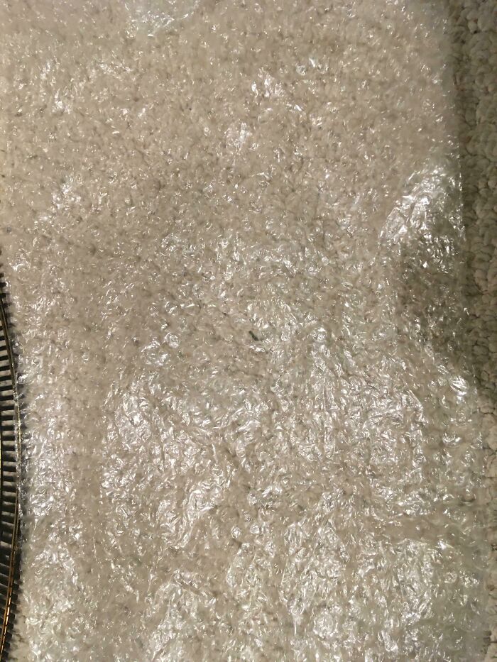 Bubble wrap placed on beige carpet, representing one of the hilariously bad Secret Santa gifts people have actually received.