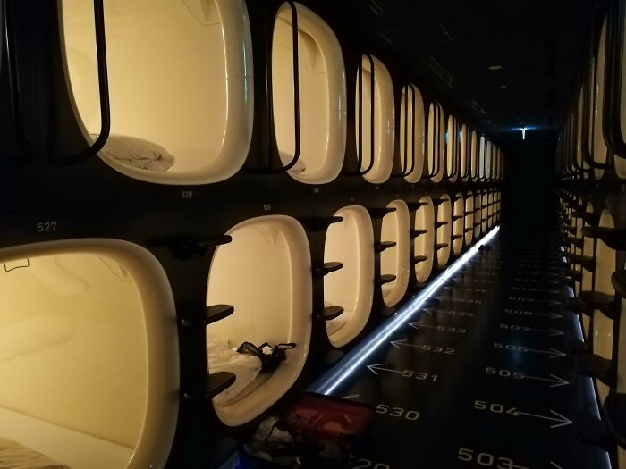 Futuristic capsule hotel room pods with soft lighting, an impressive thing some countries implemented that left people in awe
