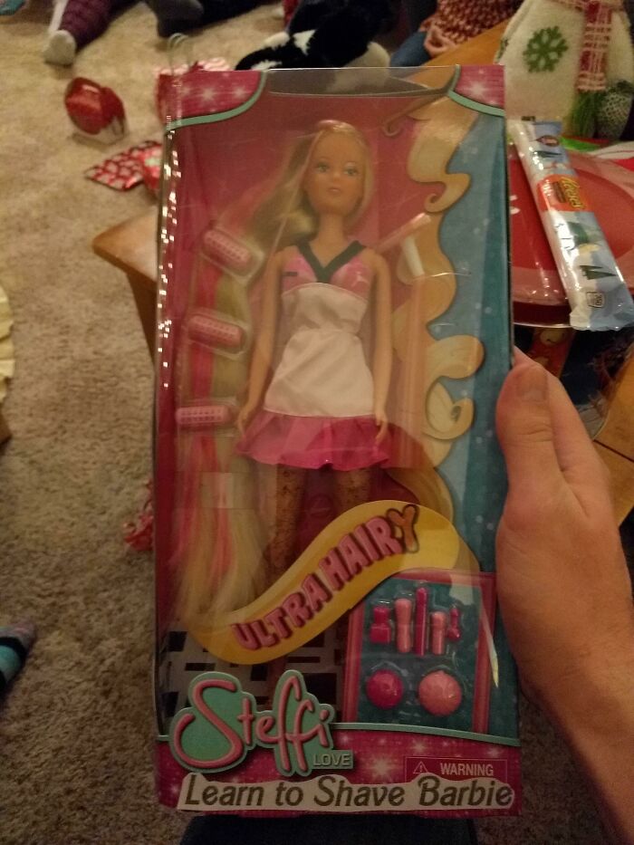 Hilariously bad Secret Santa gift of a Learn to Shave Barbie doll with hair removal accessories in packaging.