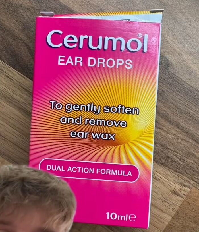 Cerumol ear drops package on wooden surface, an unusual and unwanted Christmas present among worst Xmas gifts.