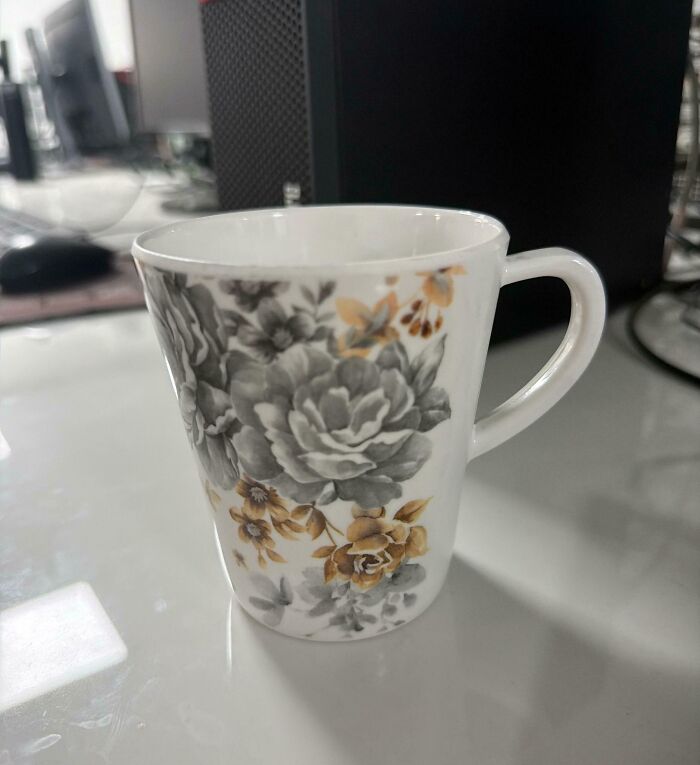 Floral ceramic mug on a desk, an example of hilariously bad Secret Santa gifts people have actually received.
