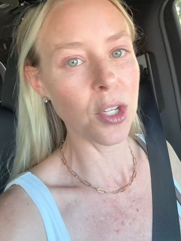 Woman in car expressing distress, representing a SAHM at a loss after husband asks for divorce unexpectedly. Woman in car expressing distress, representing a SAHM at a loss after husband asks for divorce unexpectedly.