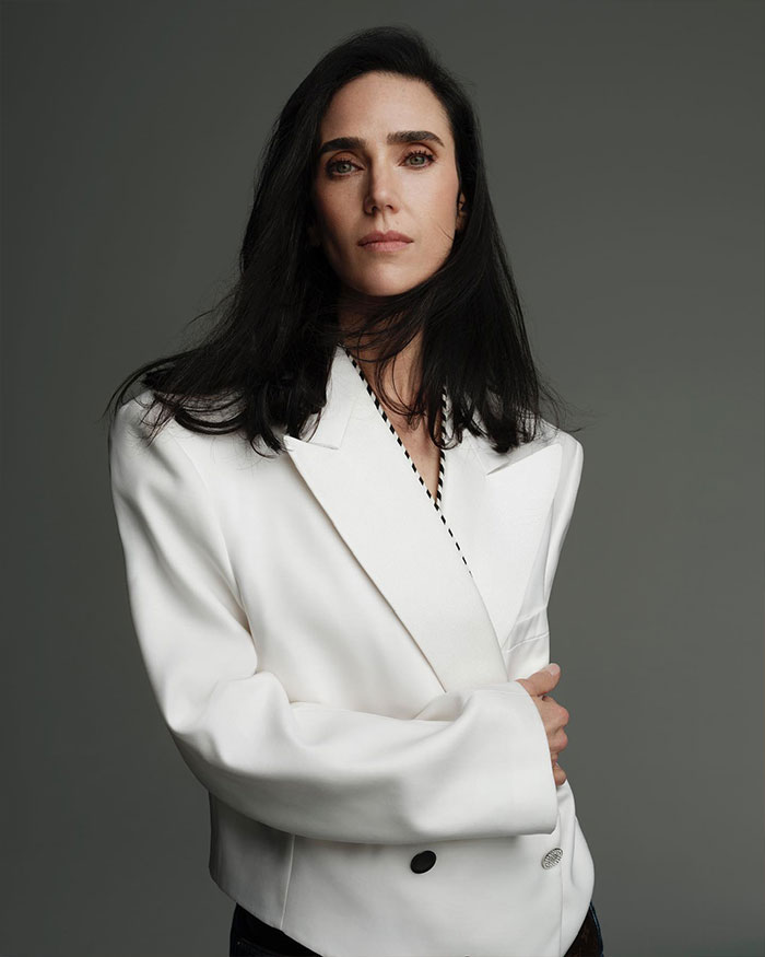 Jennifer Connelly posing confidently in a white blazer, reflecting on her iconic movie scene and career regrets. Jennifer Connelly posing confidently in a white blazer, reflecting on her iconic movie scene and career regrets.