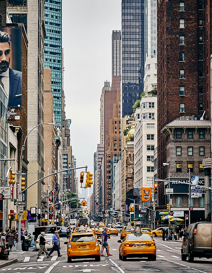 Busy Manhattan street scene with yellow taxis and pedestrians, highlighting a pit bull attack involving a toddler in the crowded area. Busy Manhattan street scene with yellow taxis and pedestrians, highlighting a pit bull attack involving a toddler in the crowded area.