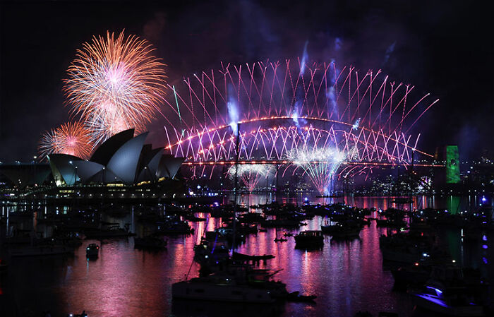 Fireworks light up the sky over Sydney Harbour during New Year&rsquo;s Eve public space celebrations.