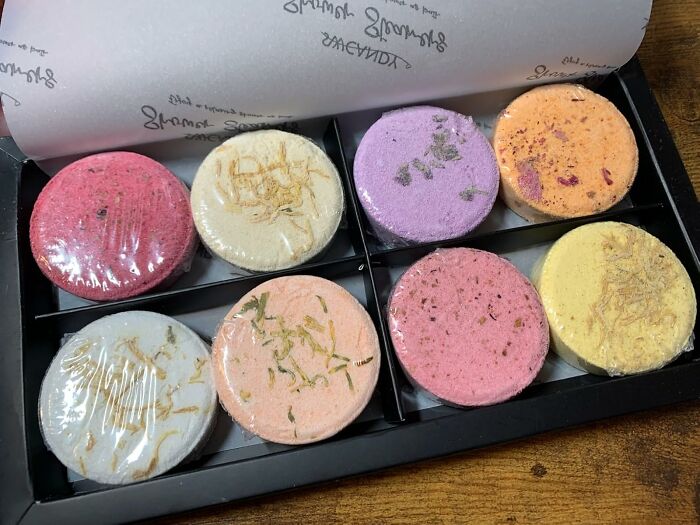 Assorted colorful host gifts in a box, featuring natural ingredients and elegant presentation for thoughtful appreciation.