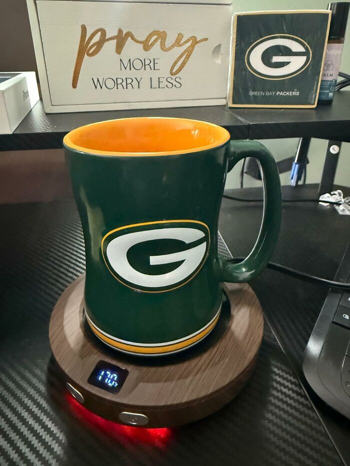 Green Bay Packers mug on a temperature control coaster, displayed among useful presents to secure favorite child status.