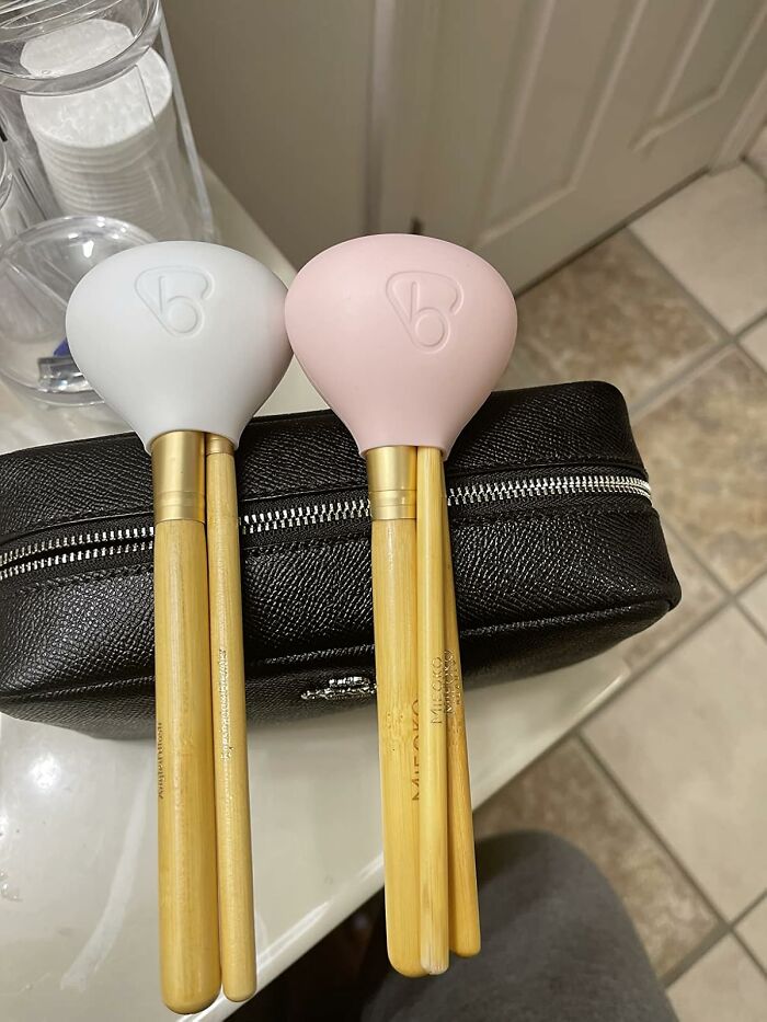 Two sets of bamboo-handled kitchen utensils with silicone heads resting on a black zippered pouch, ideal last-minute gifts.