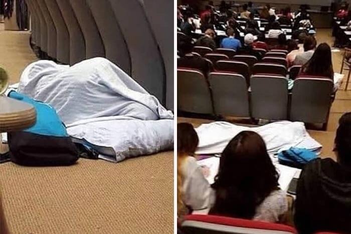 Person disguised under a blanket on the floor resembling a large head shape in a random funny situation.