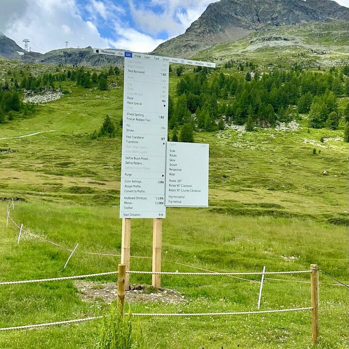 Surreal landscape with Photoshop editing menu floating on wooden poles, a trippy picture that seems plucked from another reality.